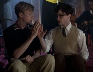 Daniel Radcliffe and Dane DeHaan, and bloody hand