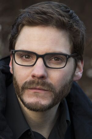 Daniel Brühl as Daniel Berg beerded close-up