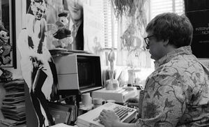 Roger Ebert behind a super old computer