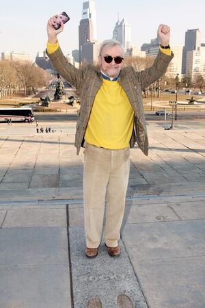 Rocky director John G. Avildsen recreates famous victory pos