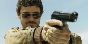 Orlando Bloom with 80s glasses and a gun, City of Violence