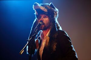 Gruff Rhys performs with hat in American Interior