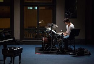 Miles Teller as Andrew Neyman practicing his drums alone