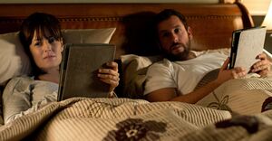 Adam Sandler and Rosemarie DeWitt in bed with their iPads