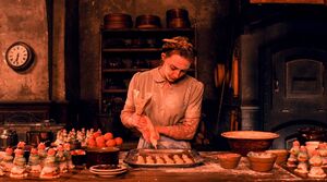 Saoirse Ronan working on her delicacies in The Grand Budapes