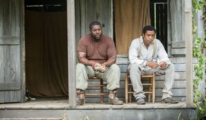 Director Steve McQueen and Chiwetel Ejiofor on the set of 12