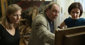 Inspecting a painting for restoration - The Great Museum