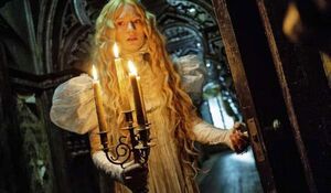 Mia Wasikowska holds some candles