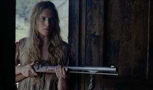 Brit Marling with very big gun