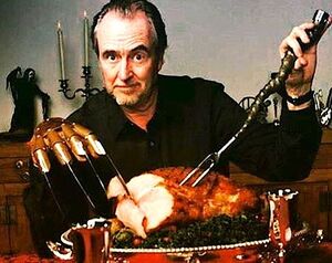 Wes Craven carving a turkey the right way.