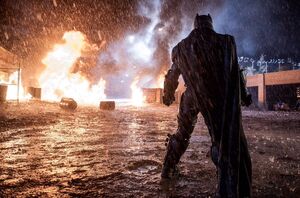Behind the scenes image shows Batman facing down the fire in