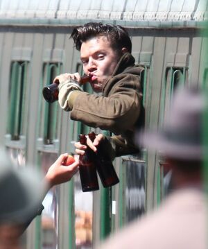 New photo of Harry Styles from the set of Christopher Nolan'