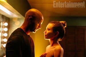 Ricky Whittle as Shadow Moon and Emily Browning as Laura Moo