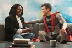 Whoopi Goldberg interviewing Superian played by Brendan Hine