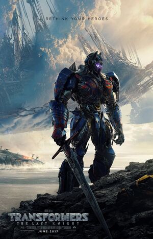 Optimus Prime stands over a fallen hero in the new poster fo