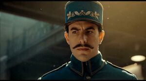 Sacha Baron Cohen as the station inspector in Hugo